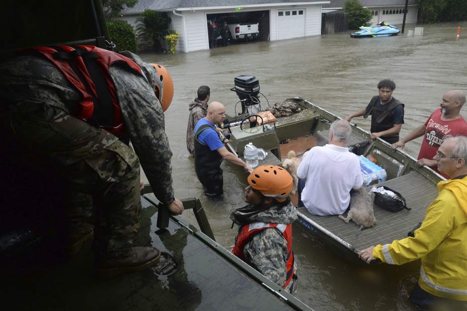 Members of the Texas National Guard at work rescuing several flood victims in the city of Cypress Creek, Texas (USA).